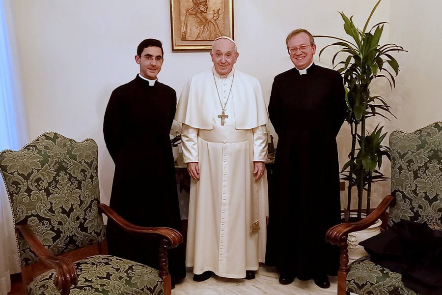 Pope Francis is pictured with Father Benoit Paul-Joseph, left, superior of the Fraternity of St. Peter's district of France, and Father Vincent Ribeton, rector of St. Peter's Seminary in Wigratzbad, Germany, during a meeting at the Vatican Feb. 4, 2022. A statement from the fraternity, a traditionalist group, said at the meeting they discussed the pope's apostolic letter "Traditionis Custodes" (Guardians of the Tradition), which limited celebrations of the rite used before the Second Vatican Council. The pope later confirmed that members of the Fraternity of St. Peter may continue to celebrate Mass, the sacraments and prayer using the pre-Vatican II texts and forms.