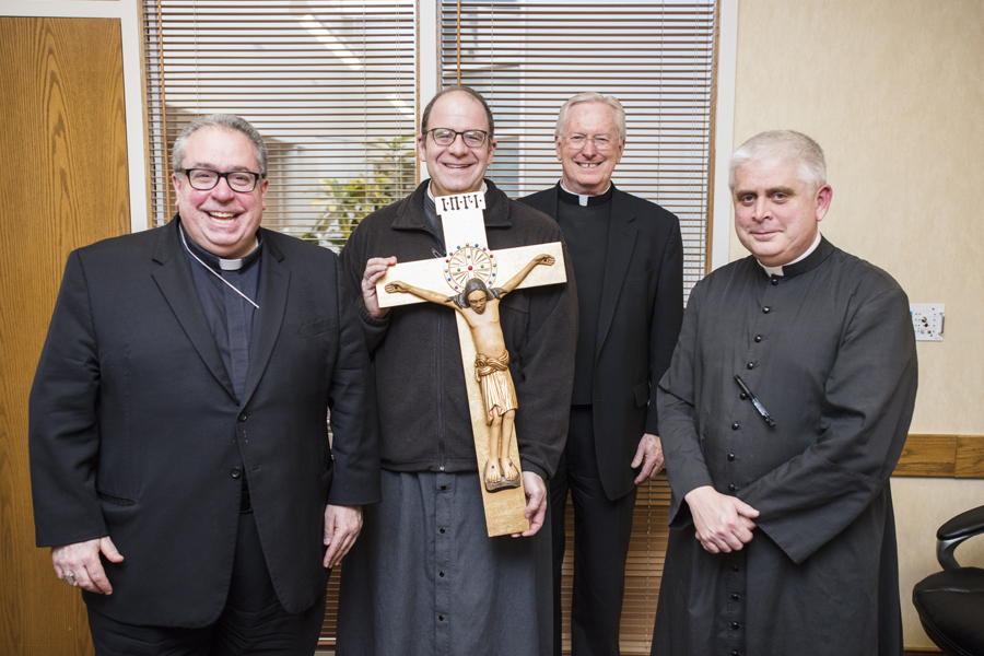 Bishop Michael Olson and other priests
