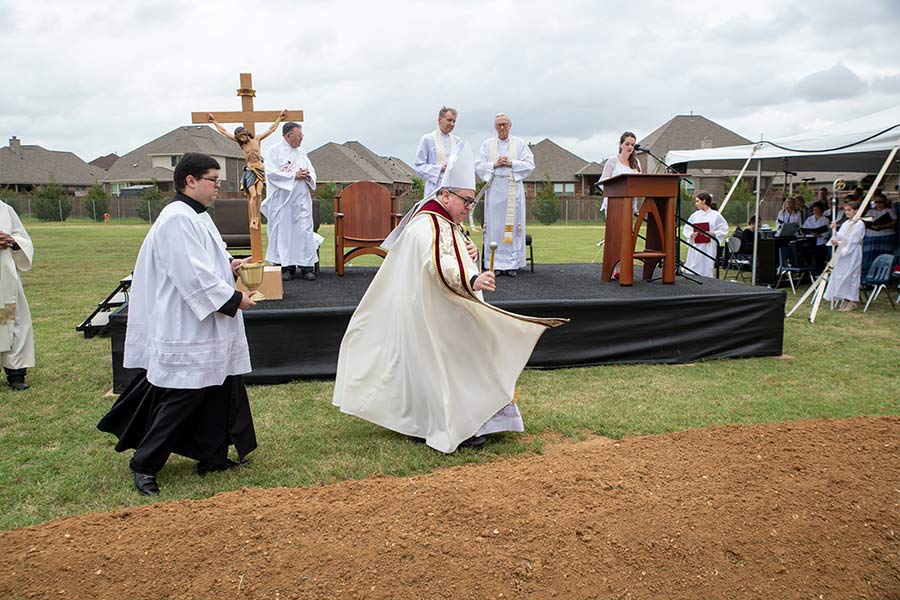 Bishop Olson blesses the land at St. Mark Catholic Church’s Groundbreaking Ceremony on April 23, 2022. (NTC/Joseph Barringhaus)