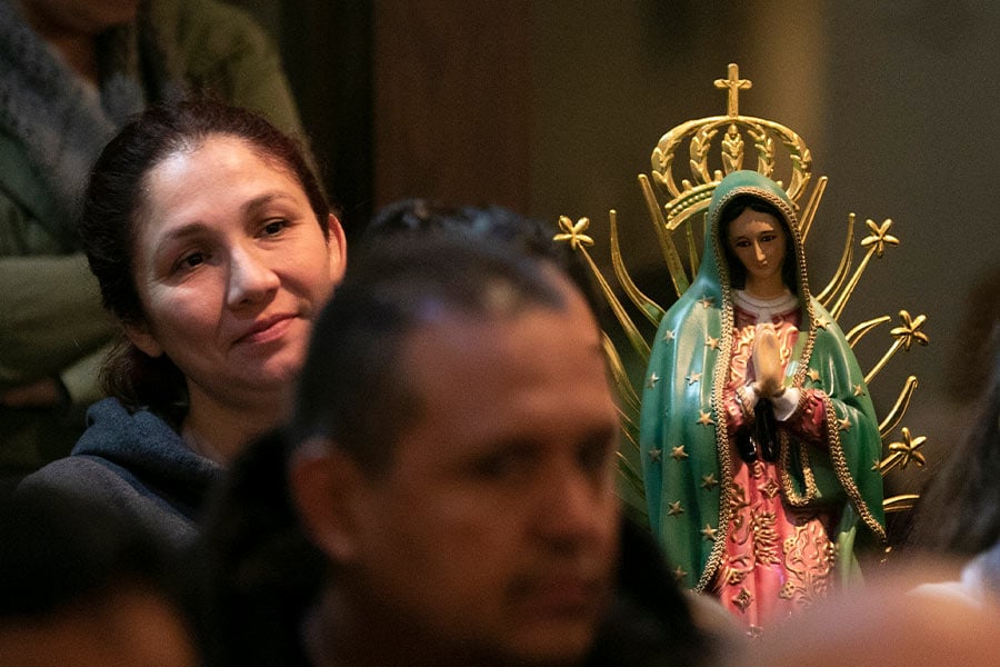 Anabel Casique sits with her statue of Mary as she attends Mass on the Feast of Our Lady of Guadalupe at Immaculate Heart of Mary Church in Fort Worth December 12, 2018. (NTC/Rodger Mallison)