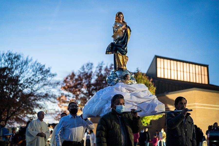 Parishioners carry a statue of the Virgin Mary during a procession on the Solemnity of the Immaculate Conception at St. Peter the Apostle Church in Fort Worth. (NTC/Juan Guajardo)
