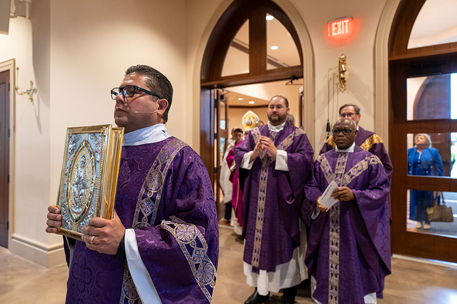 Deacon Rigoberta Leyva with book of Gospels