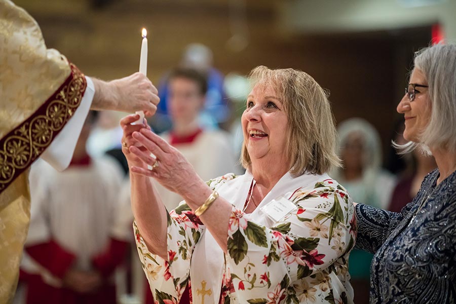 Linda Wigginton and 10 others received the three sacraments of initiation of the Catholic Church at the Easter Vigil Mass.