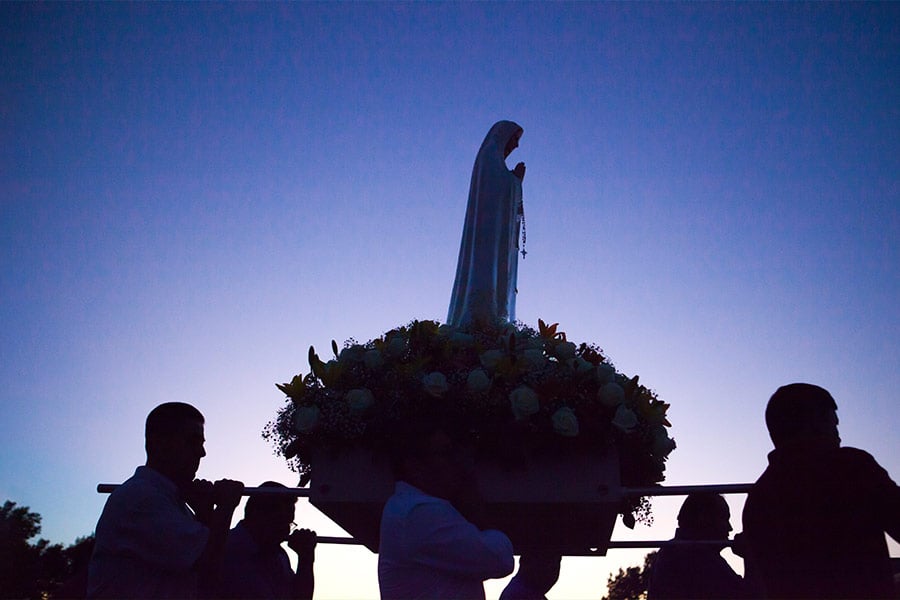 Parishioners of St. Peter the Apostle Church carry the statue of Our Lady of Fatima during a procession on her feast day. (NTC/Juan Guajardo)