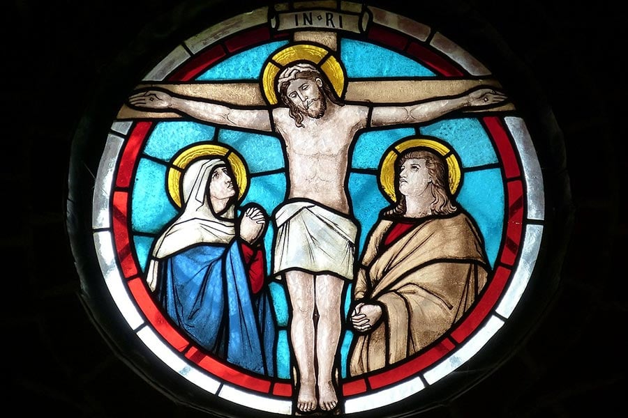 Stained glass image of Christ on the Cross.