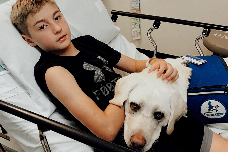 Kid and a dog at Oregon Catholic hospital