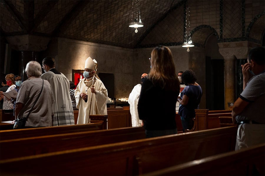 Washington Cardinal Wilton D. Gregory processes into Mass in the Crypt Church at the Basilica of the National Shrine of the Immaculate Conception in Washington Sept. 16, 2021. The percentage of Catholics in the U.S. population in 2021 held steady at 21% in the latest Pew Research Center survey, issued Dec. 14. (CNS photo/Tyler Orsburn)