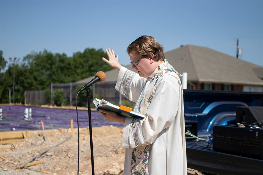 Father John Robert Skeldon blesses the ground of the new missionary crisis pregnancy and pro-life resource center May 14. (NTC/Jayme Donahue)