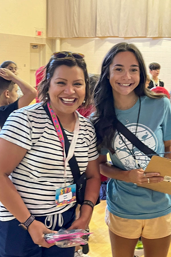 Ines Roach with teenage helper