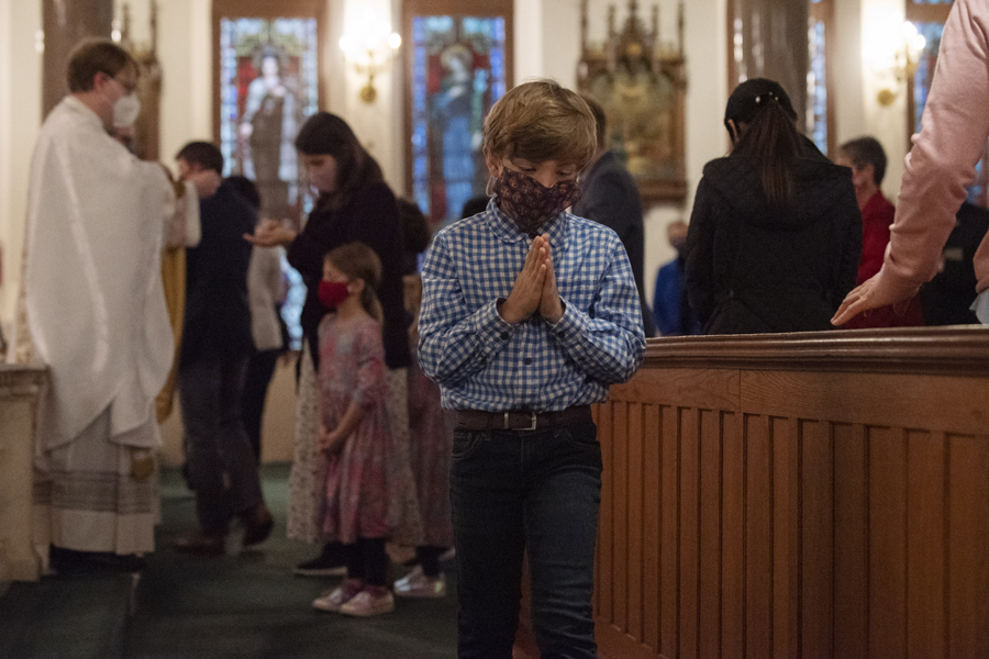 A boy receives Holy Communion