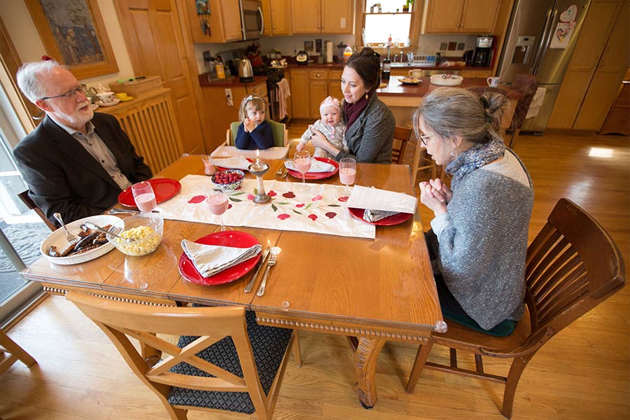 The Naughton family of St. Paul, Minn., gather for the Lord's Day prayer and brunch April 25, 2021. Pictured are Michael Naughton, granddaughters Siena and Ruth Gooding, daughter Clare Gooding, and wife, Teresa. (CNS photo/Dave Hrbacek, The Catholic Spirit)