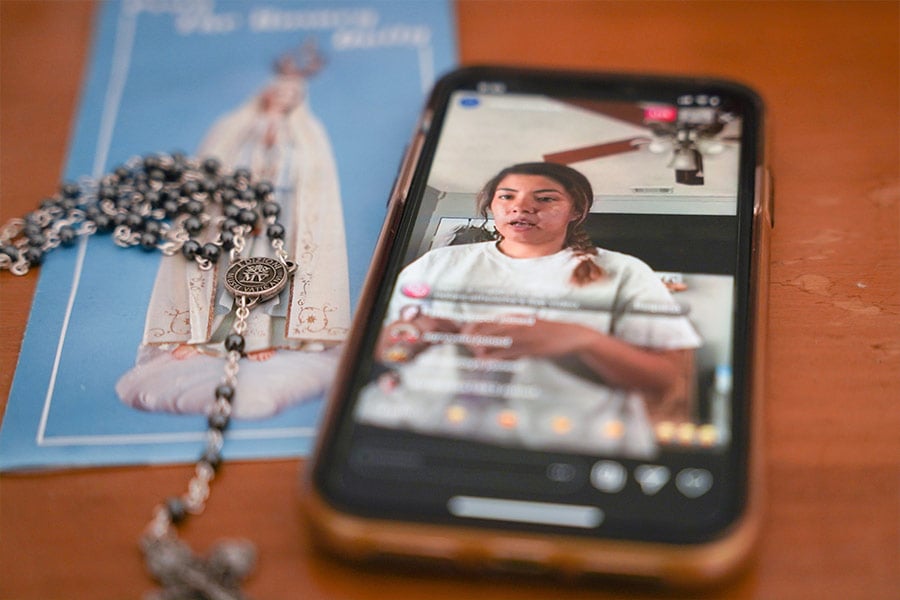 Nolan Catholic High School LIFE Team member Cecy Soto prays the Rosary live on Nolan Catholic's Instagram account on Thursday, March 26. A variety of virtual websites and livestreaming platforms are being used by youth to keep connected with fellow young Catholics. (NTC/Anna Engelland)