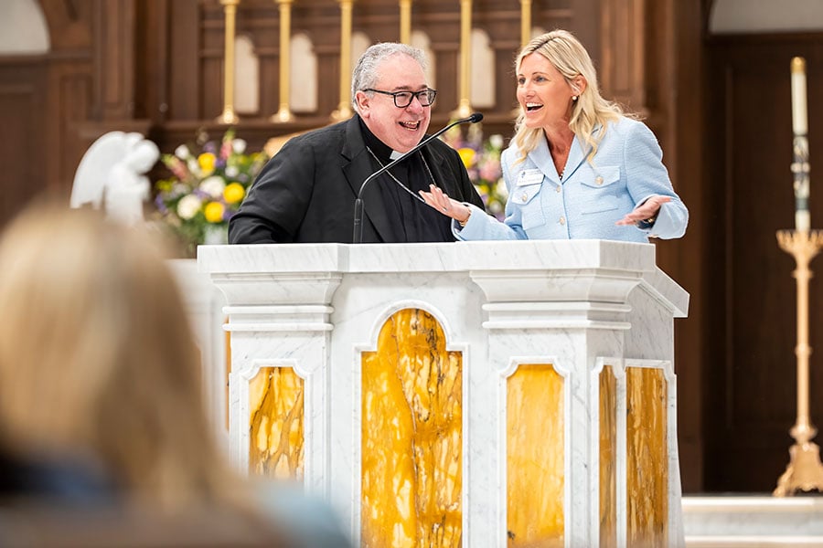 Bishop Olson and Melissa Kasmeier-Millard at ambo