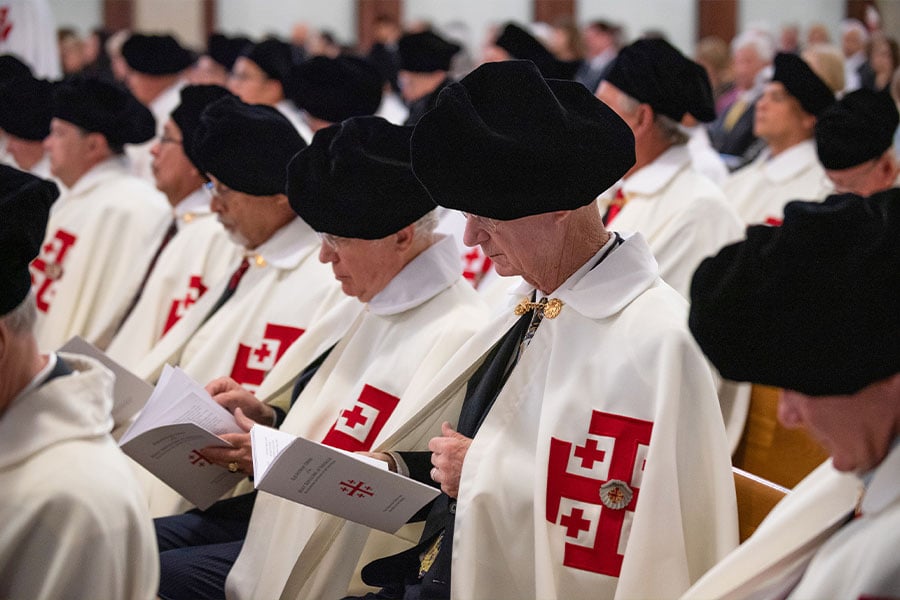 Knights of the Equestrian Order of the Holy Sepulchre of Jerusalem stand during a special memorial Mass at Vietnamese Martyrs Church in Arlington, on Oct. 16, 2021. (NTC/Ben Torres)