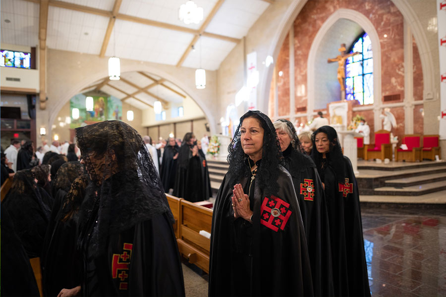 Dames of the Equestrian Order of the Holy Sepulchre of Jerusalem process into at Vietnamese Martyrs Catholic Church in Arlington. (NTC/Ben Torres)