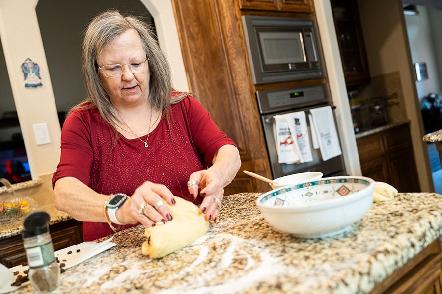 woman works with bread dough