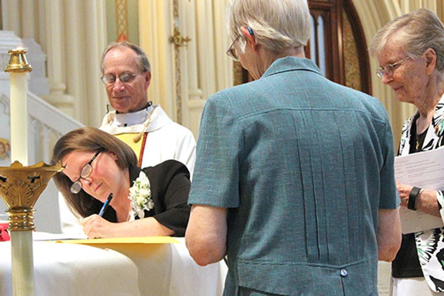 Sister Megan Grewing is seen making her first profession of vows on June 16, 2017.