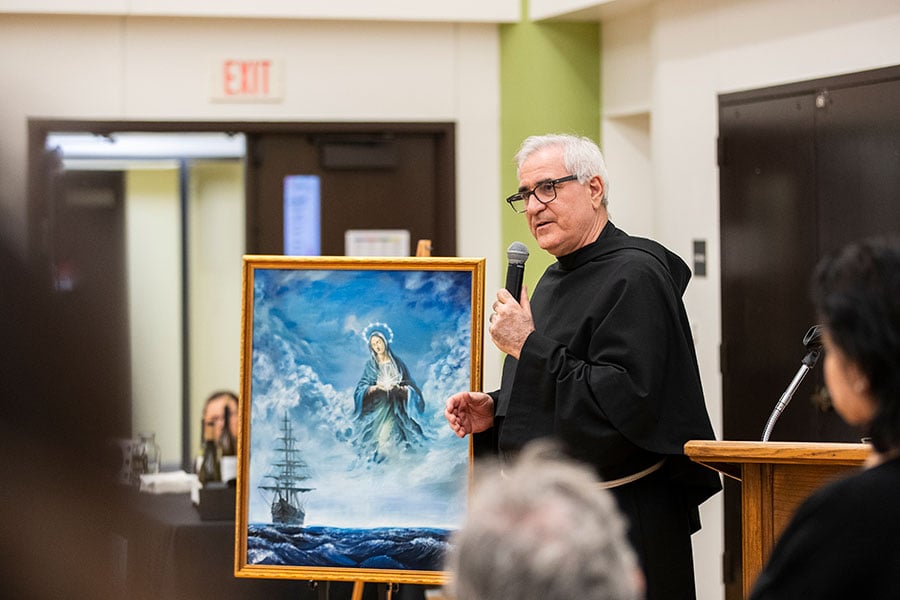 Fr. Pattee with painting