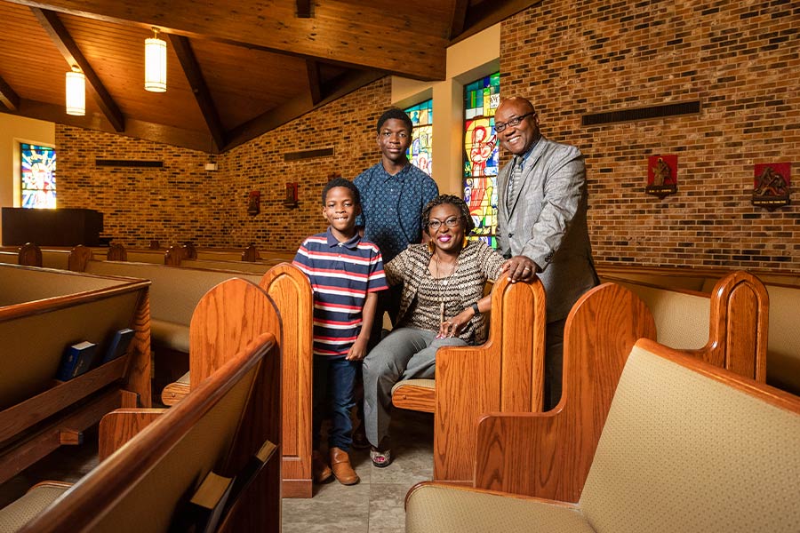 They are: Jane-Mary and Jean-Patrice Tchatat, with their children Zane (left) and Frederick at St. Bartholomew Parish in Fort Worth. Daughter Maya is not pictured. (NTC/Ben Torres)