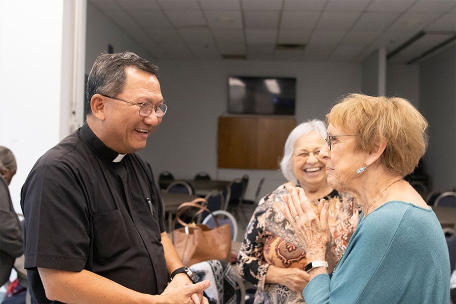 Father Nguyen speaks to St. Vincent de Paul members during their 75th anniversary reception April 28th at Holy Family parish. (NTC/Jayme Donahue)