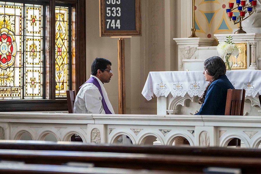 Father Alexander Ambrose, HGN, hears a confession at St. Mary of the Assumption Church in Fort Worth. (NTC/Juan Guajardo)