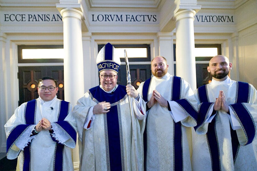 Bishop Michael Olson poses with Paul Trinh, Trent Barton, and Jeffrey Ambreit following their ordination to the transitional diaconate on March 18, 2026 at St. Mary of the Assumption in Fort Worth. (NTC/Juan Guajardo)