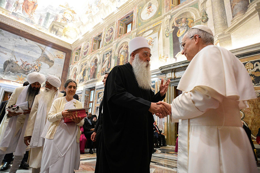 Pope Leo XIV greets visitors.