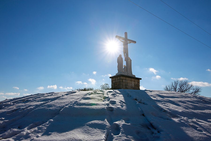 Statue of Jesus in snow