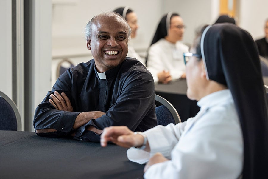 priest and nun trade laughs