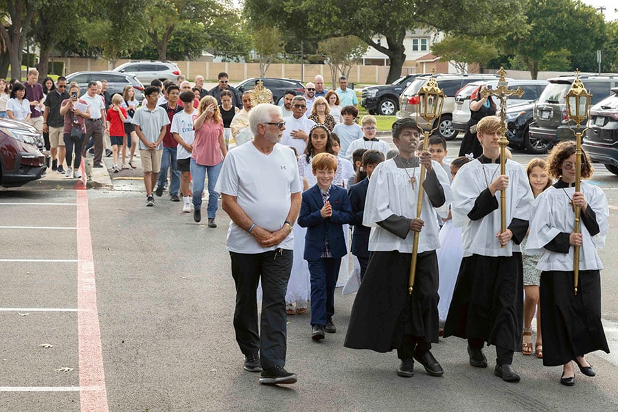 altar servers with crucifix