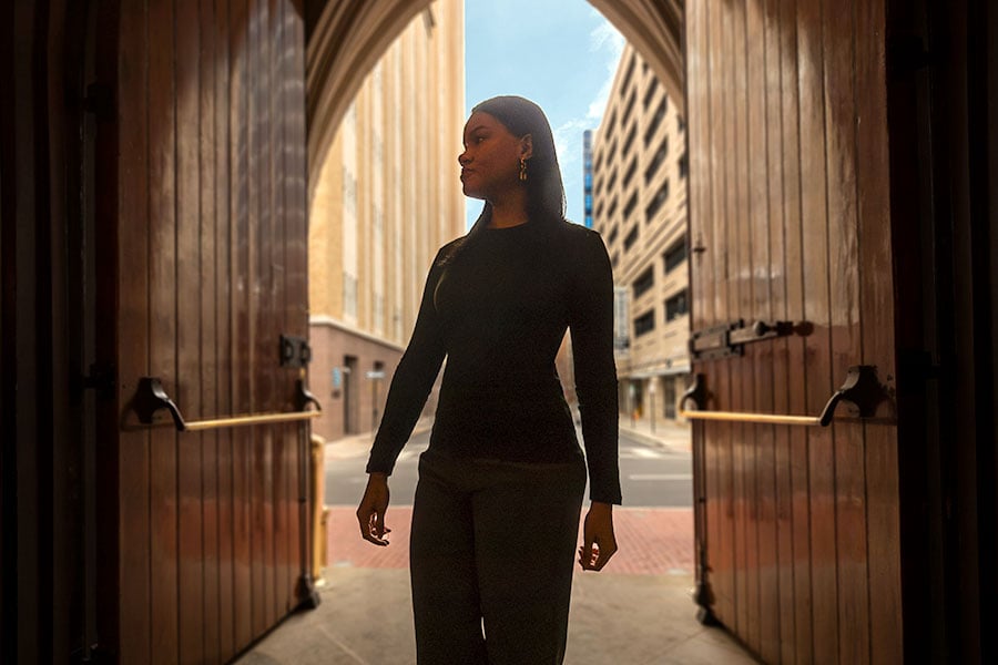 a woman enters St. Patrick Cathedral