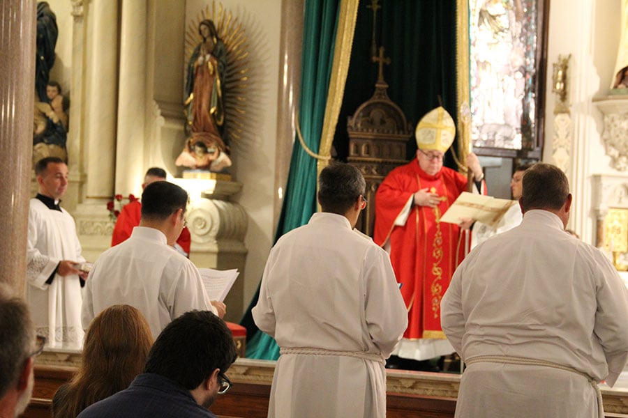 Before ordination as deacons, three men sign Oath of Fidelity