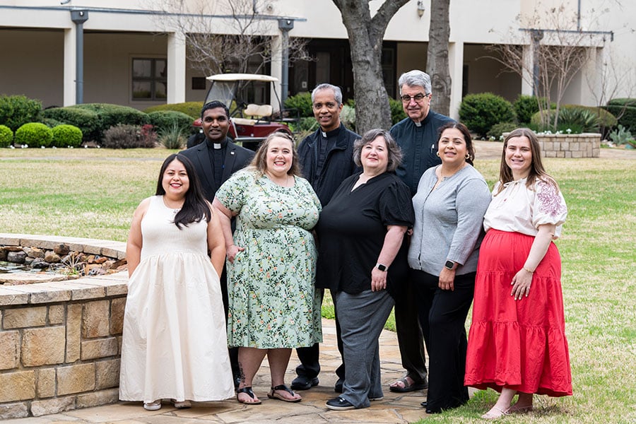 From left, back row: Father Sam Antony, SAC, JCD; Father Joy Joseph, TOR, JCL; and Father Tim Thompson, JCL. From left, front row: Marisol Castrellon, chief notary; Cheyenne Marrinan, director of the tribunal; Elizabeth Scagel, ecclesiastical notary; Dagcy Castañeda, ecclesiastical notary.; and Eva Friddell, ecclesiastical notary. (NTC/Juan Guajardo)