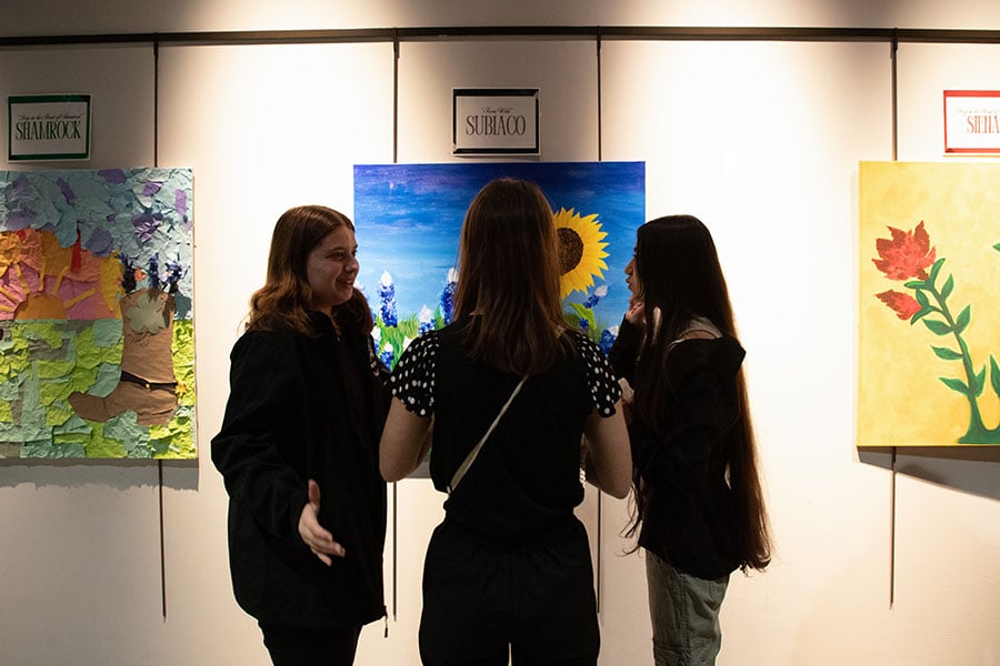 students look at art