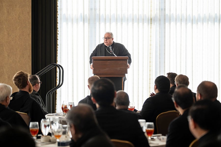 Bishop Michael Olson speaks to a room full of priests