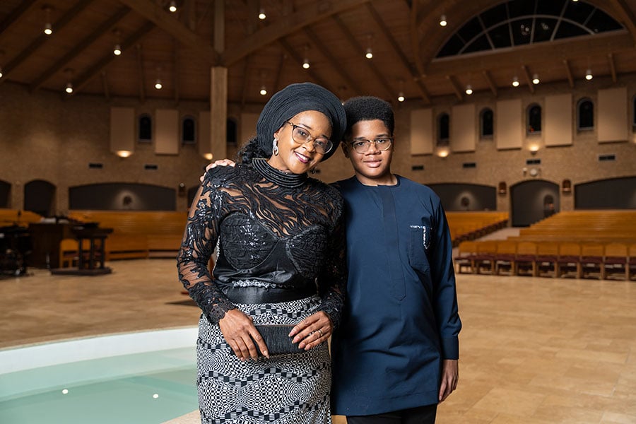 Dr. Philomena Ikowe with one of her three sons at St. Joseph Catholic Church in Arlington, her home parish. 