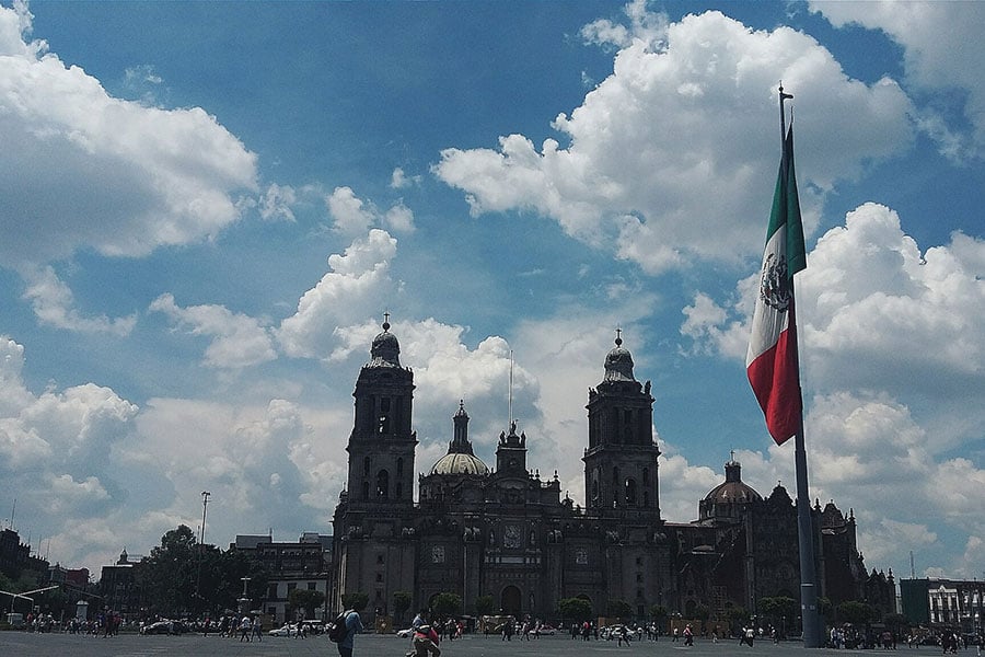 A view of Mexico City’s main square, the Plaza de la Constitución, better known as the Zócalo, and the Metropolitan Cathedral of the Archdiocese of Mexico City. ("Plaza Principal de la Ciudad de México" by Pequeño mar, CC BY 4.0/Cropped from original)