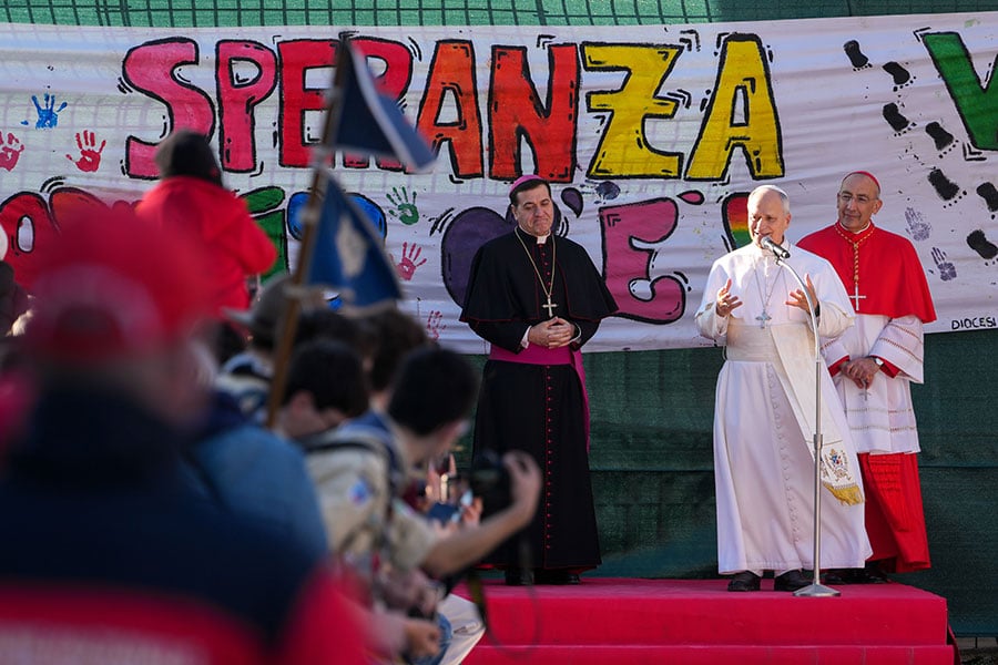 Pope Leo XIV speaks to young people during a visit to the Parish of Santa Maria Regina Pacis in Ostia Lido, Italy, Feb. 15, 2026, accompanied by Bishop Renato Tarantelli Baccari, vice-regent of the Diocese of Rome, left, and Cardinal Baldassare Reina, papal vicar of Rome, right. (CNS photo/Lola Gomez)