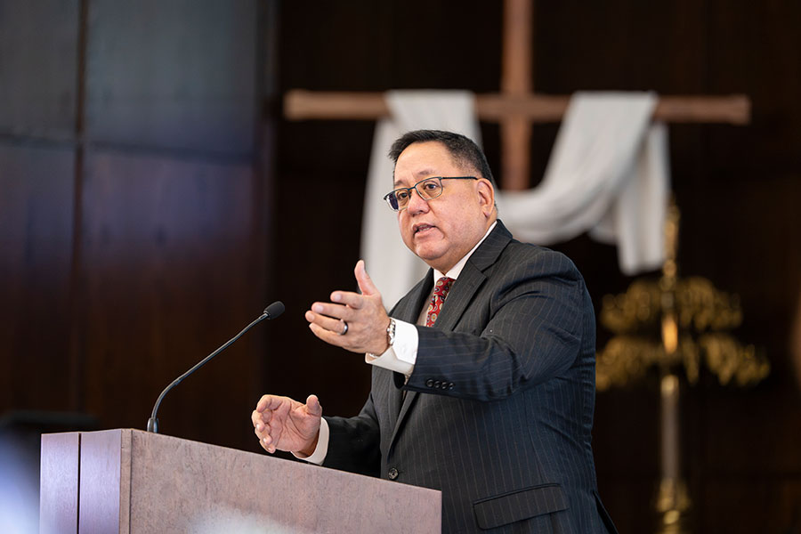 Deacon Bernie speaks at the podium