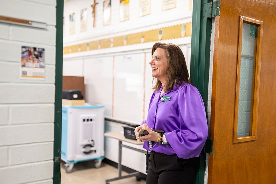 Kindra Johnston, principal, checks in on classes on the first day of school at St. Rita Catholic School in Fort Worth August 13, 2025. (NTC/Juan Guajardo)