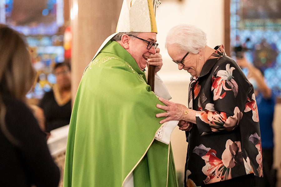 Bishop Olson congratulates Pat Pelletier