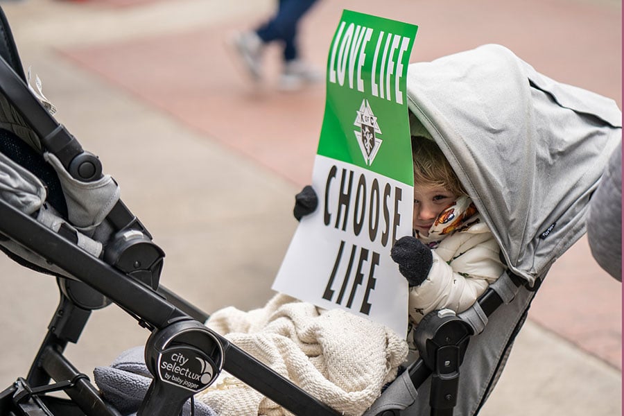 A youngster holds up a sign during the North Texas March for Life on January 15, 2022 in Dallas. The march marked the 49th anniversary of the Roe v. Wade decision that legalized abortion in America. (NTC/Juan Guajardo)