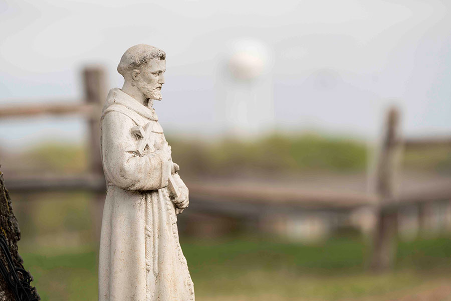 St. Francis statues are a common sight in residents' yards at St. Francis Village. (NTC/Juan Guajardo)