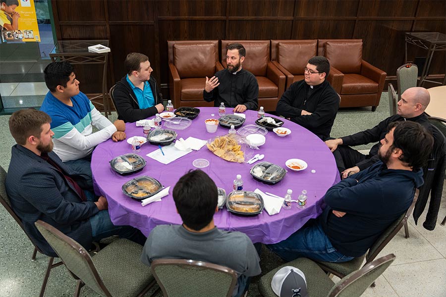 Father Joe Keating and seminarians from the Diocese of Fort Worth lead a discussion on discerning one's vocation on March 17, 2022 at St. Patrick Cathedral. The event began with a Holy Hour of Adoration followed by dinner and a discussion on prayer, priestly vocations, and discernment.