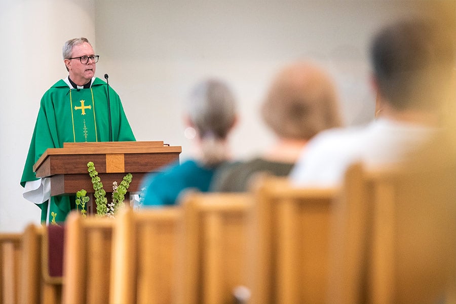 Father Tony Rauschuber, SJ, director of Montserrat Jesuit Retreat House, talks about our baptismal call to mission during his homily at the World Mission Mass at St. Catherine of Siena Church in Carrollton Oct. 23, 2021. (NTC/Juan Guajardo)
